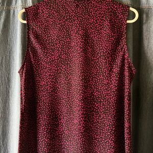 Ladies sleeveless blouse, new with tags.